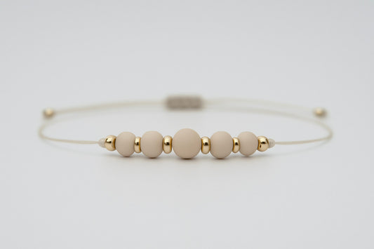 Fossilstein Armband mit dunkler Keshi Perle | geknüpft